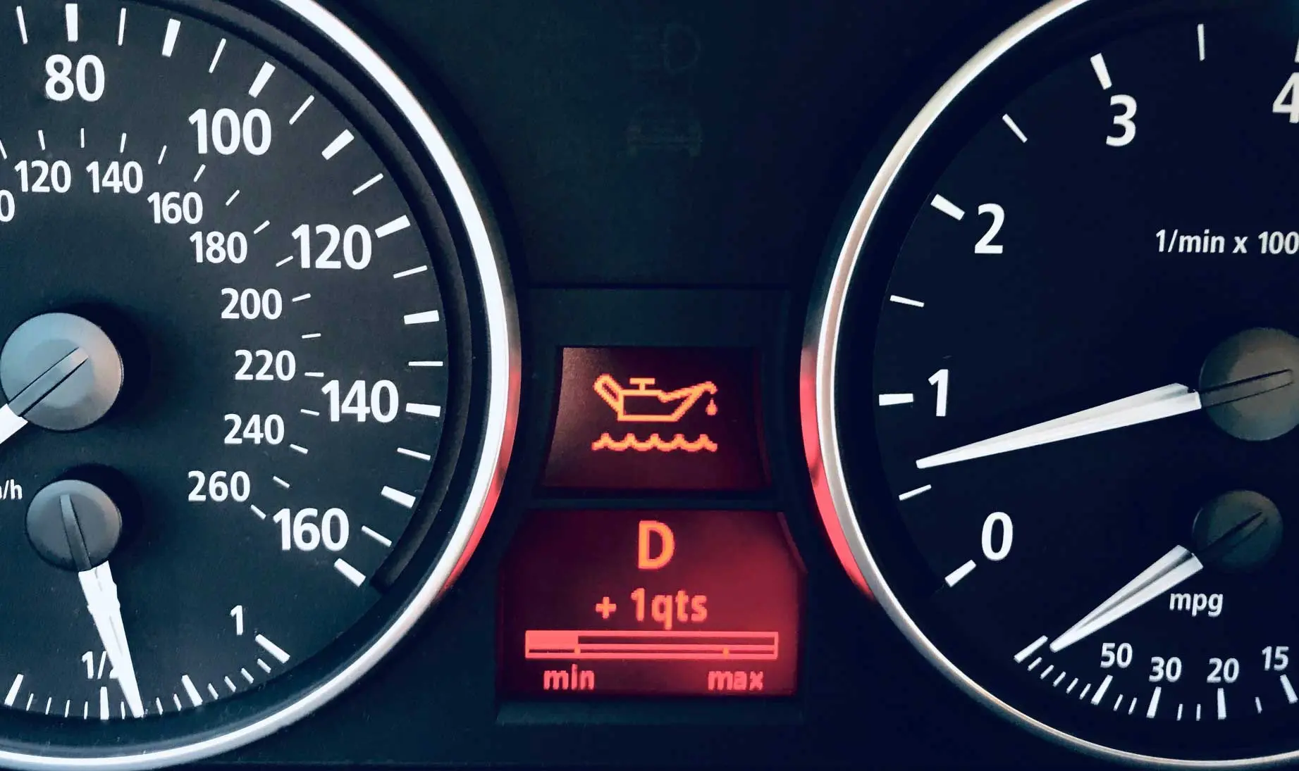 Oil warning light on a car dashboard, C.A.M.S. car mechanics Chippenham